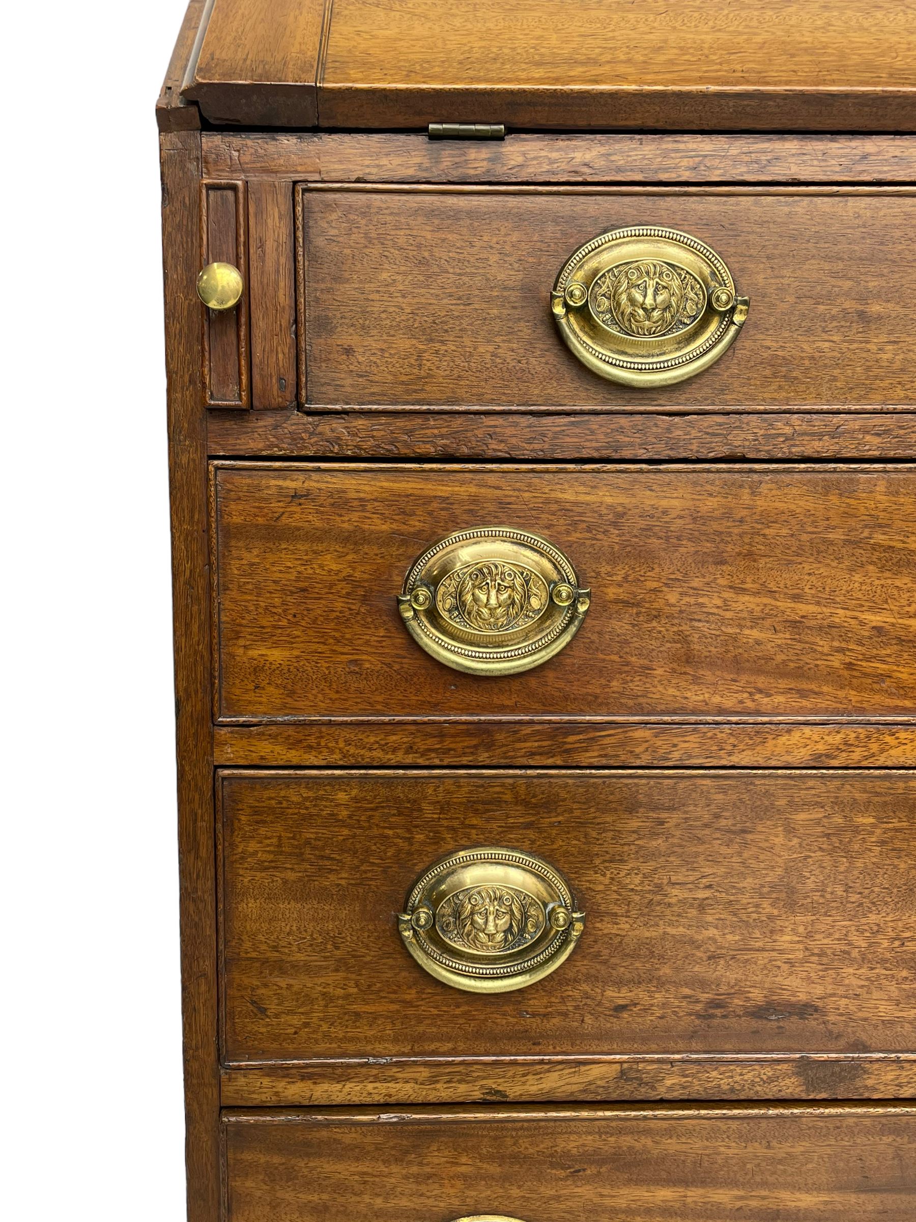 George III mahogany bureau, the fall-front banded and with boxwood stringing, enclosing fitted interior with pigeonholes and drawers surrounding a central cupboard with inlaid shell motif, the base with four graduating cock-beaded drawers, each with pressed brass handle plates with central lion masks and ivory escutcheons, on shaped bracket feet
This item has been registered for sale under Section 10 of the APHA Ivory Act