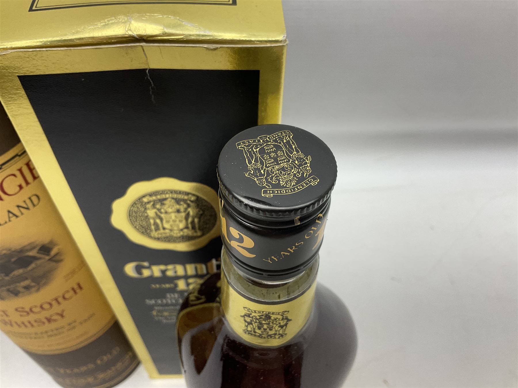 Glenmorangie, ten year old Scotch whisky, 1 litre 43% vol, Grant's twelve year old Scotch whisky 1 litre, 43 G.L and Johnnie Walker Black Label, twelve year old Scotch whisky, 1 litre 43% vol, all boxed (3)