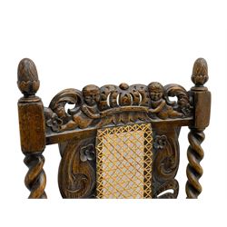 Set six 19th century oak Carolean style dining chairs, the cresting rail with open crown flanked by putto, spiral turned uprights with pineapple finials, canework seat and back, the seat rails carved with foliage, spiral turned supports joined by s-scroll and open crown carved front rail, decorated with flower heads, each with upholstered seat pad