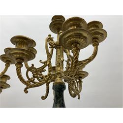 Pair of 20th century continental seven branch candelabras, gilt metal and variegated green marble, with cherub decoration raised on a plinth with paw feet, H61cm