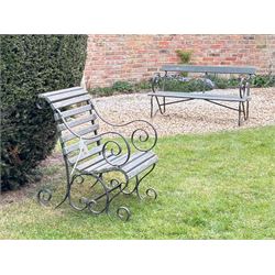 20th century scrolled wrought iron garden bench (L140cm) together with a similar chair (2) 