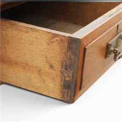 Victorian pitch pine writing table with leather inset top, rectangular top with three frieze drawers, pierced brass handles, raised on turned and fluted supports terminating in castors