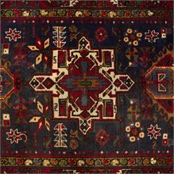 Large Northwestern Persian Hamadan hand-knotted runner, indigo field, with a column of bold geometric medallions and scattered stylized motifs within a madder border of angular rosettes and meandering vines 