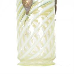 Arts & Crafts brass ceiling lantern with a trio of fluer-de-lis mounted arms, the vaseline glass pendant light shade of cylindrical form with flared rim, H52cm