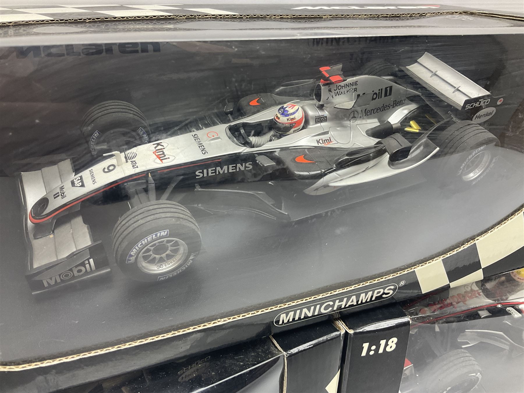 Three Minichamps 1:18 scale die-cast McLaren racing cars - Mercedes MP4-19 D. Coulthard; Mercedes MP4-20 K. Raikkonen; and Vodaphone Mercedes MP4-22 L. Hamilton 2007; all boxed (3)

