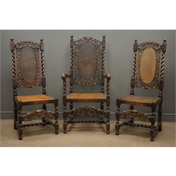  Early 20th century set three oak Carolean style chairs (2+1), cresting rails and frame carved and pierced with scrolls and foliage, barley twist supports, caned backs and seats, W57cm, H122cm, D56cm  