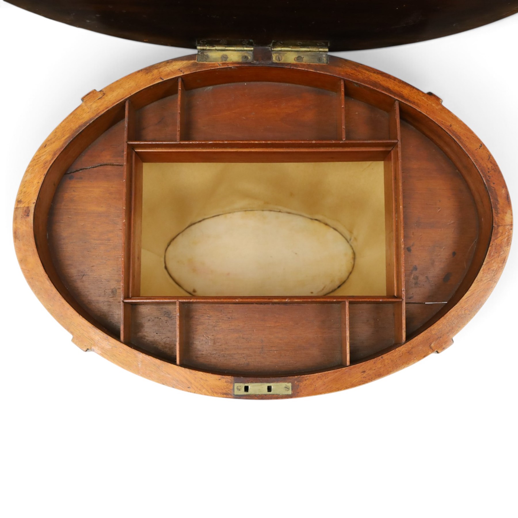 Edwardian inlaid satinwood oval sewing or work table, crossbanded and ebony-strung hinged top enclosing fitted compartment and olive-green upholstered well, raised on square tapering splayed supports united by under-tier 