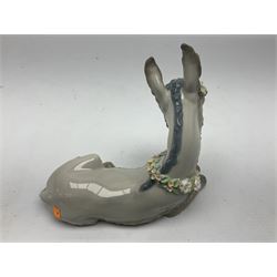 Lladro figures of animals, comprising Mini Lion no 5436, Beautiful Burro no 5683, Hawk Owl no 5422, Beagle Puppy Sitting no 1071, Duck Flying no 1264, Miniature Cat no 5308 and Small Papillon Dog no 4749, four with original boxes, largest example H14cm