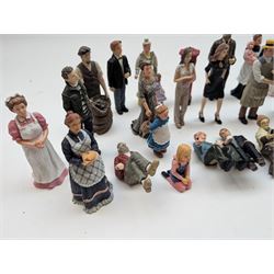1:12 scale dolls house composite figures, including policeman, postman, maid, sitting and standing people in various styles of dress, etc