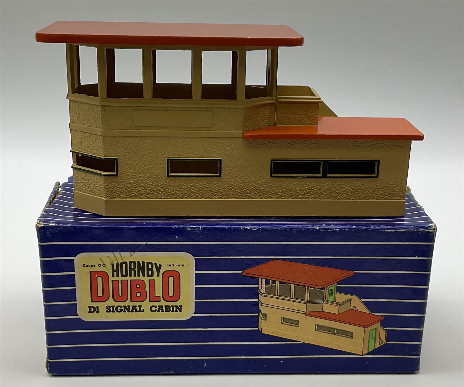 Hornby Dublo - wooden D1 Main Line Station and D1 Goods Depot, both in pale blue boxes; die-cast D1 Through Station in plain blue box; die-cast D1 Island Platform and D1 Signal Cabin, both in blue striped boxes (5)
