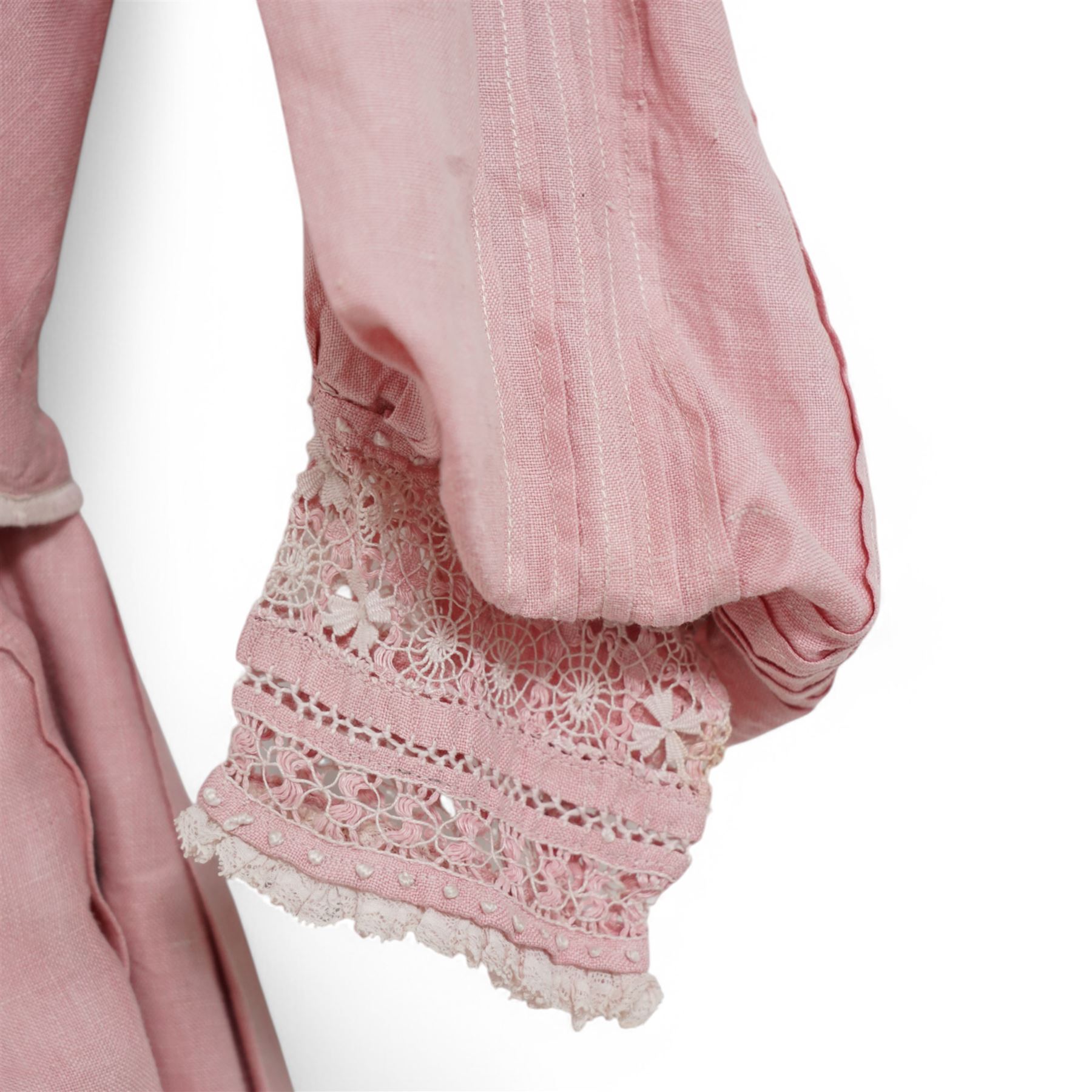 Edwardian ladies pink linen bodice and skirt, with eyelet closure and lace detailing to skirt cuffs and collar, with gathered and pleated detailing 