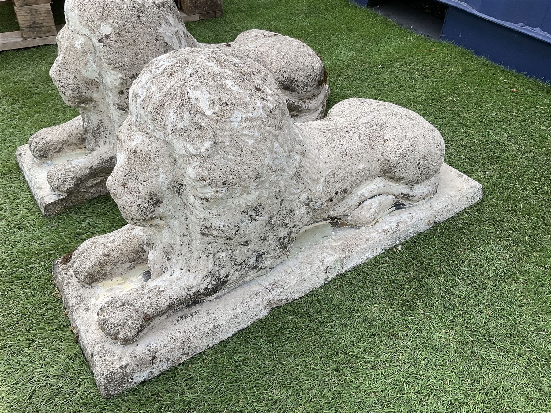Pair composite stone garden recumbent lions - THIS LOT IS TO BE COLLECTED BY APPOINTMENT FROM DUGGLEBY STORAGE, GREAT HILL, EASTFIELD, SCARBOROUGH, YO11 3TX