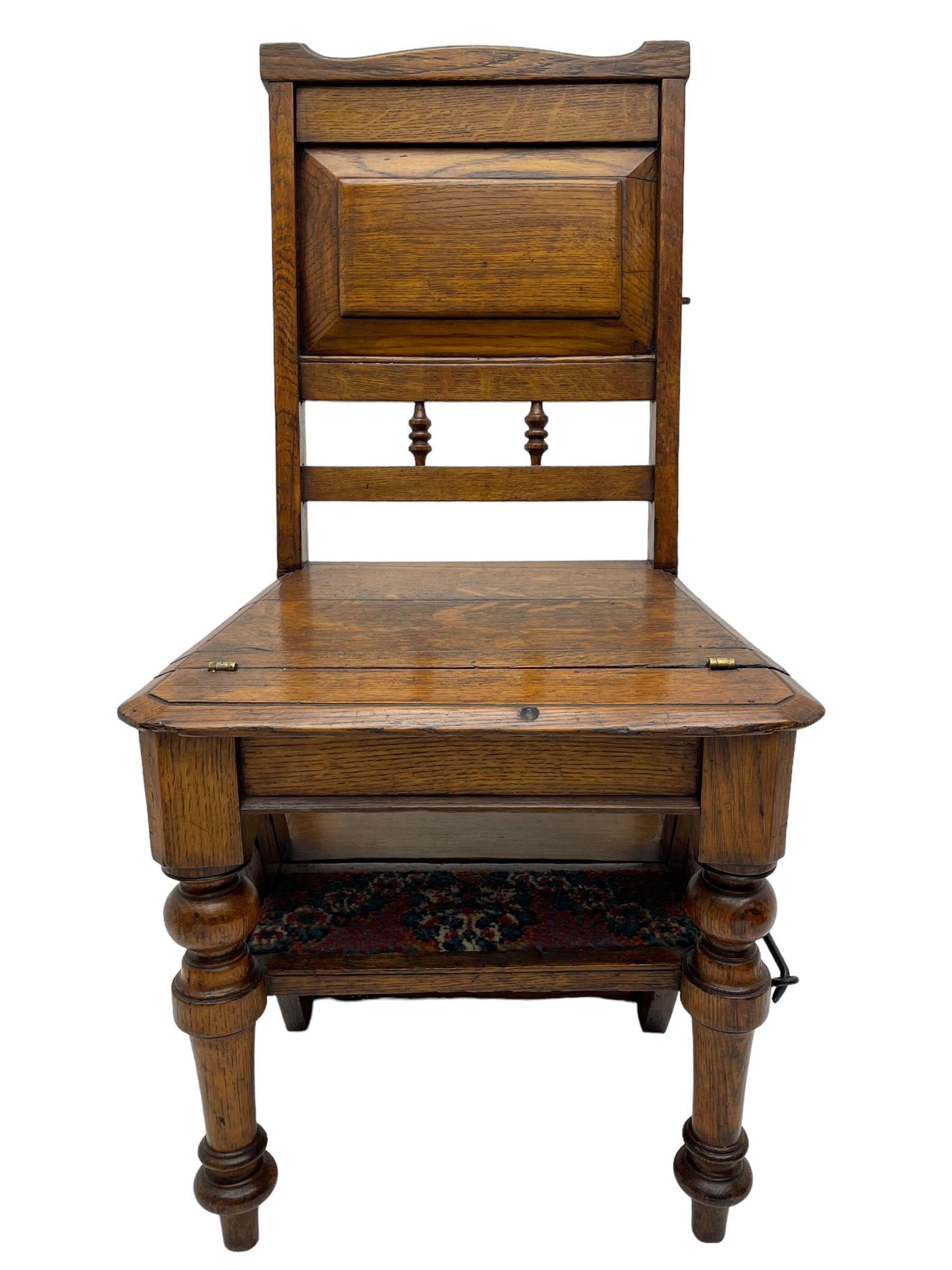 19th century oak metamorphic library steps and chair, panelled back with turned spindles over plank seat with turned front supports, the hinged seat folding forward, the steps inset with carpet treads  