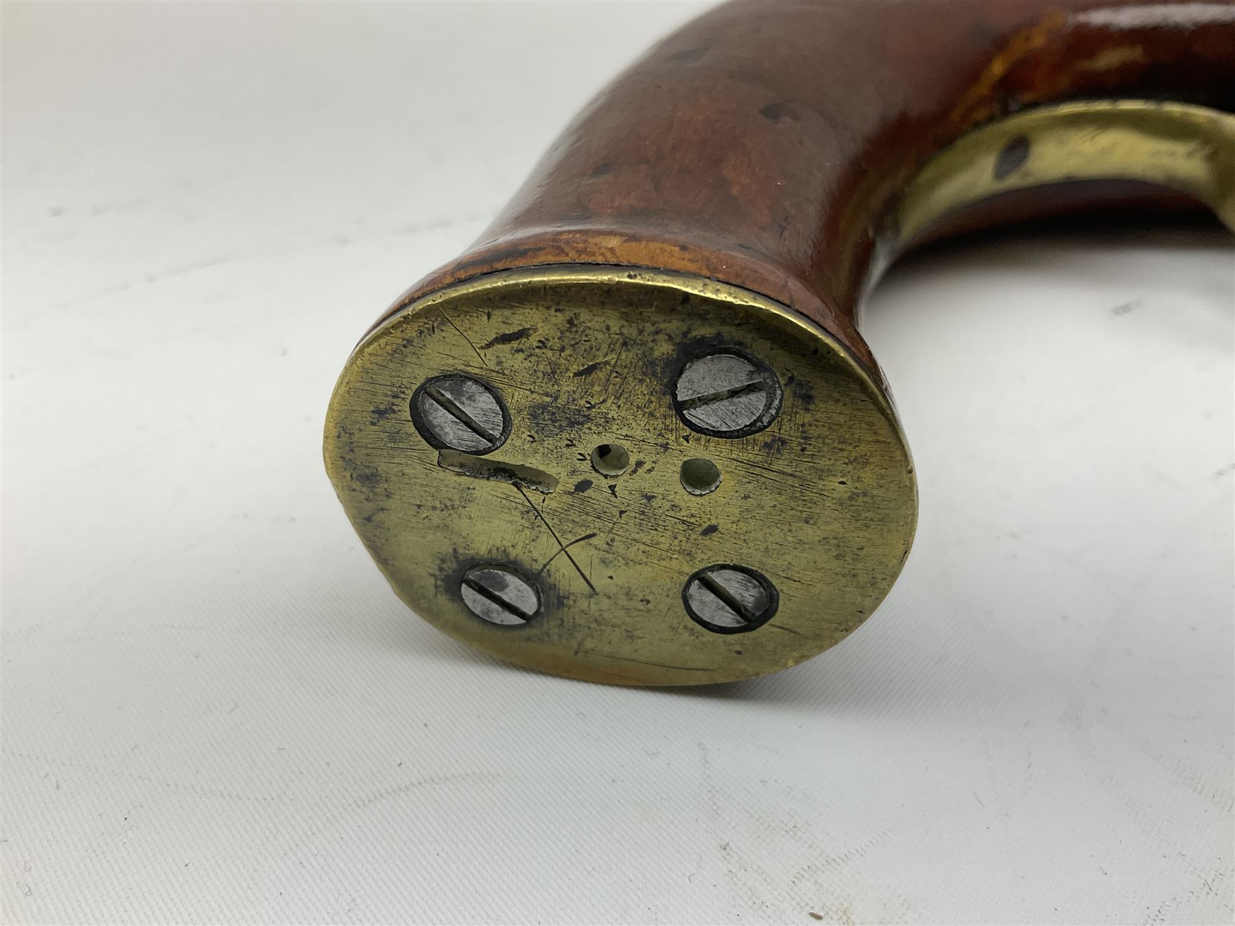 Re-manufactured percussion converted from flintlock single barrel pistol, the 20cm barrel with ramrod under, reused back action lock, brass furniture and hardwood stock L41cm overall