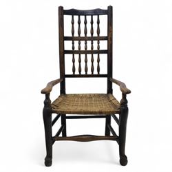 19th century country elm spindle back armchair, shaped cresting rail over two rows of turned spindles, shaped open arms over rush seat, on front turned supports, joined by stretchers 