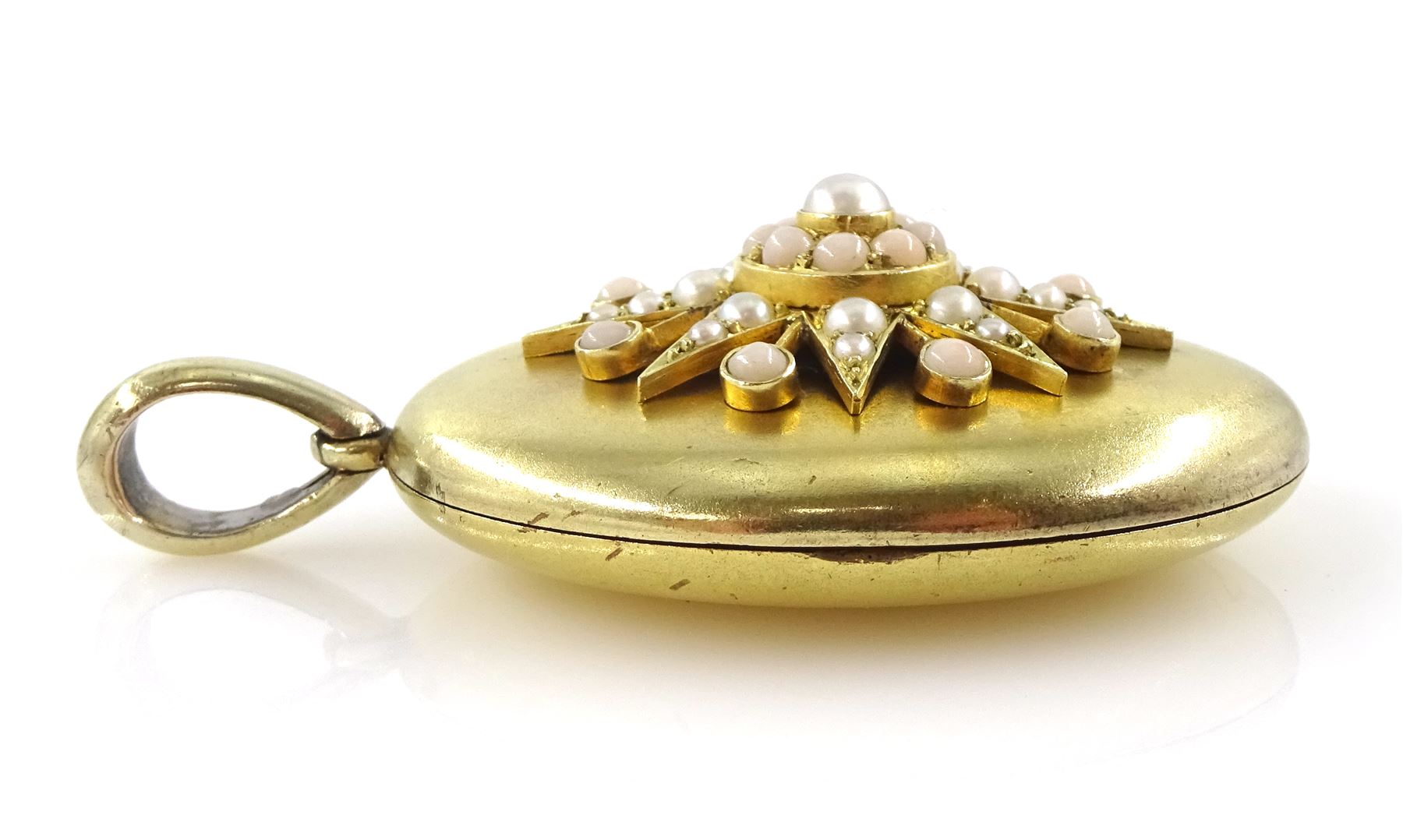 Victorian 15ct gold locket pendant, the centre with applied pearl and coral decoration, stamped 15