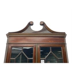 Edwardian mahogany corner display cabinet, scrolled swan neck pediment over astragal glazed doors, fabric lined interior, on cabriole feet 
