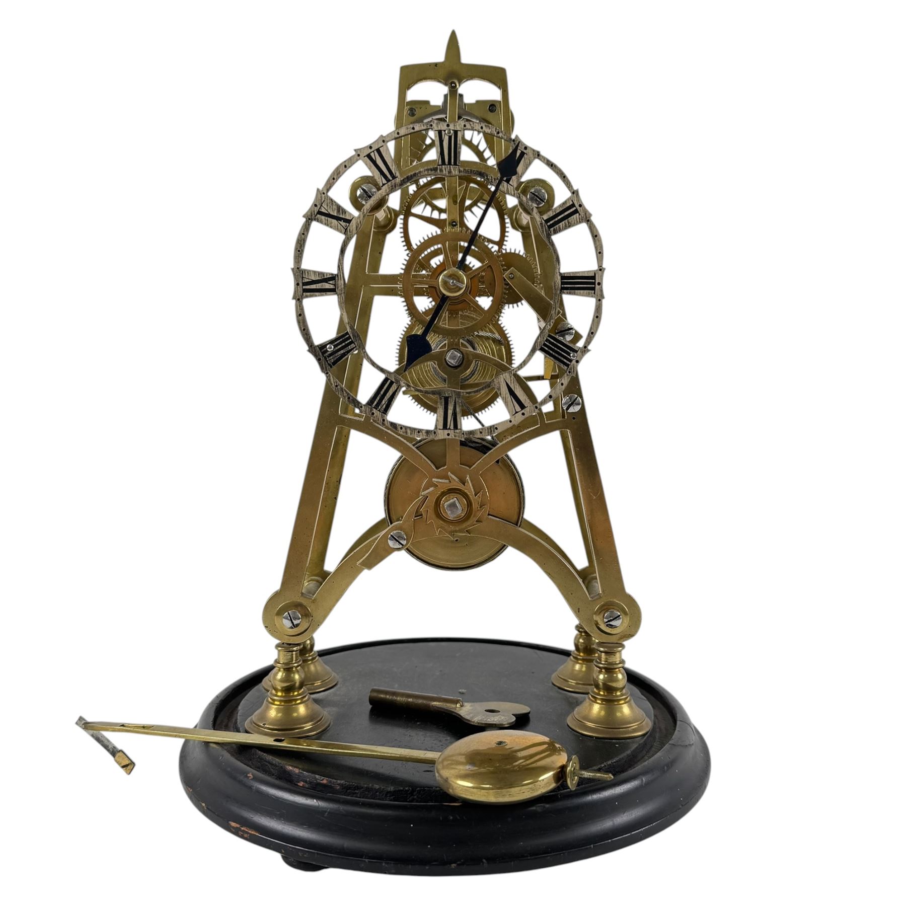 Brass skeleton clock, the single fusee movement with silvered Roman numeral dial, upon an ebonised circular base, missing the glass dome, H32cm