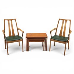 A pair of Nathan 'Highback Carvers' and a 20th century nest of teak tables, (Tables W65cm,...