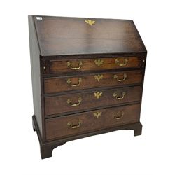 Georgian oak bureau, fall front enclosing fitted interior, four long graduating drawers, on bracket feet