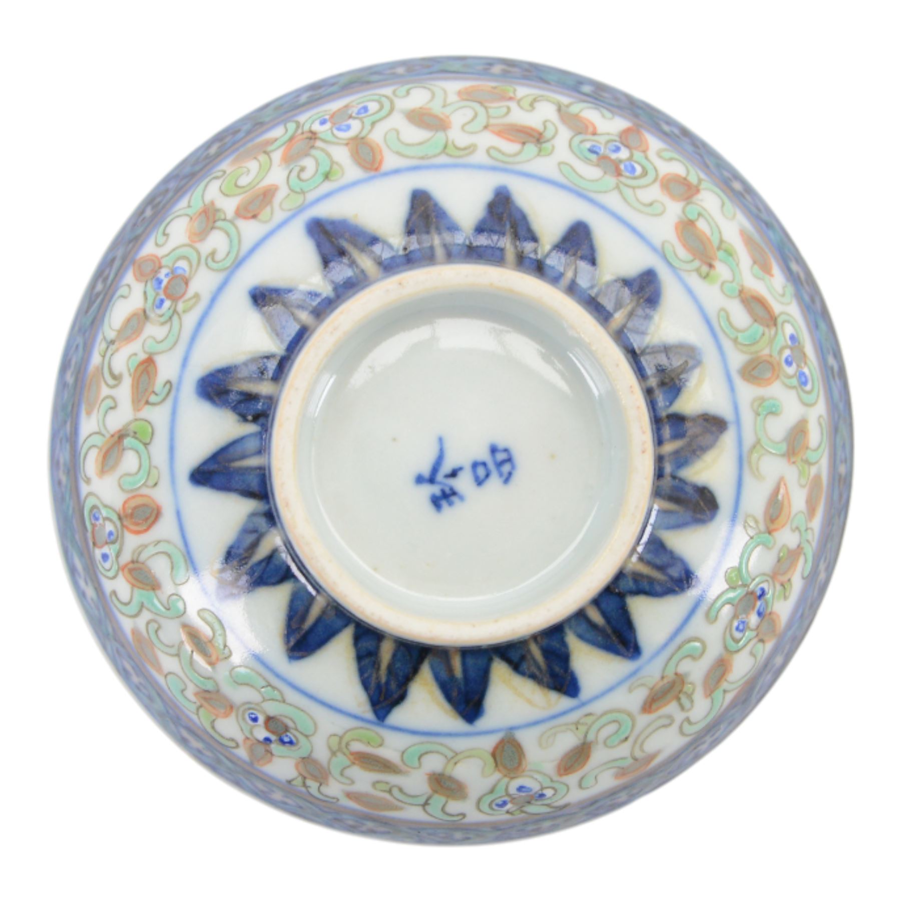 Chinese late Qing Dynasty Guangxu period rice grain detailed teabowl and saucer, each decorated in underglaze blue with flowers and foliate borders, and further detailed with iron red and pale green band of flower heads, and scrolling bands, teabowl with apocryphal Kangxi mark beneath and saucer with apocryphal Qianlong mark beneath, teabowl H5cm, saucer D10cm