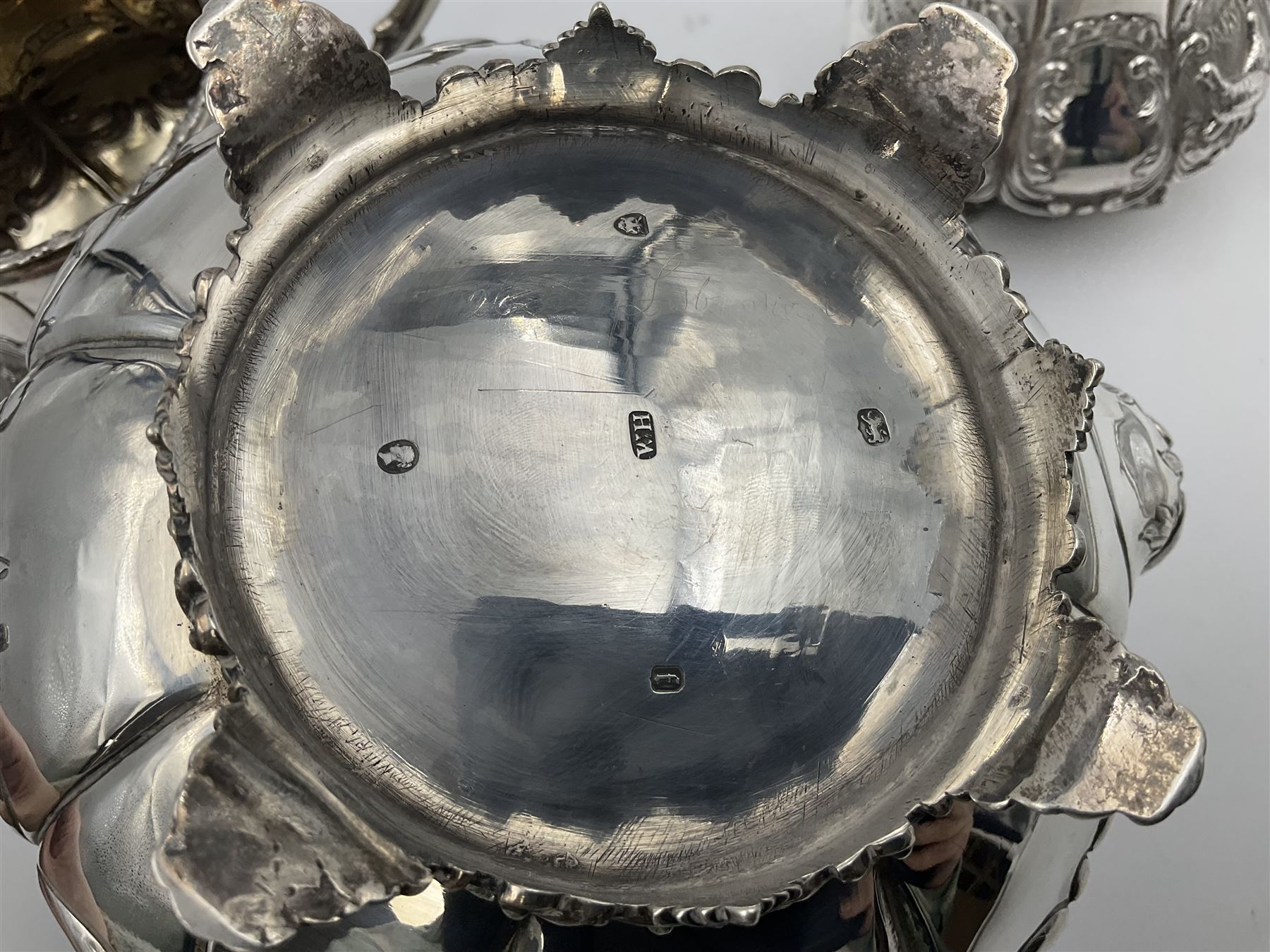 Victorian silver three piece tea service, comprising teapot, twin handled open sucrier, and milk jug, each of bellied form with acanthus capped scroll handles, the sides embossed with alternating scroll edged vacant panels and panels containing a pair of birds, upon four palmette feet, the teapot with ivory insulators to handle, and bird finial to the hinged domed cover, hallmarked William Hunter & Son, London 1861, teapot H19cm, including handles sucrier H13.5cm, including handle milk jug H12cm

This item has been registered for sale under Section 10 of the APHA Ivory Act