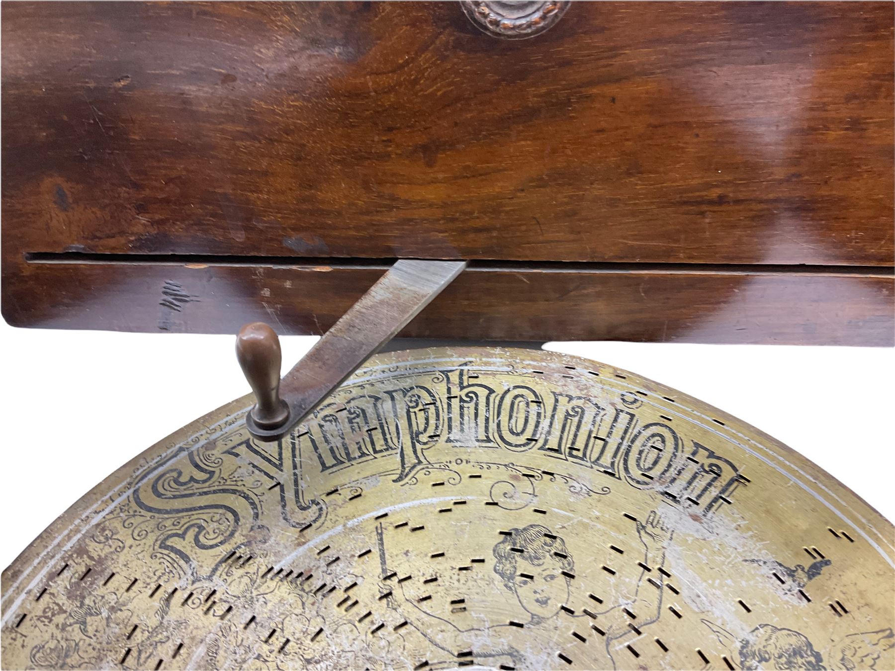 Late 19th century Symphonion disc musical box in inlaid walnut case with front lever action playing 25.5cm discs on a 10.5cm steel comb with forty-nine teeth, musical scene of cherubs under the lid, L33cm; together with five 25.5cm discs, fifteen 20.5cm discs and eleven 19cm discs