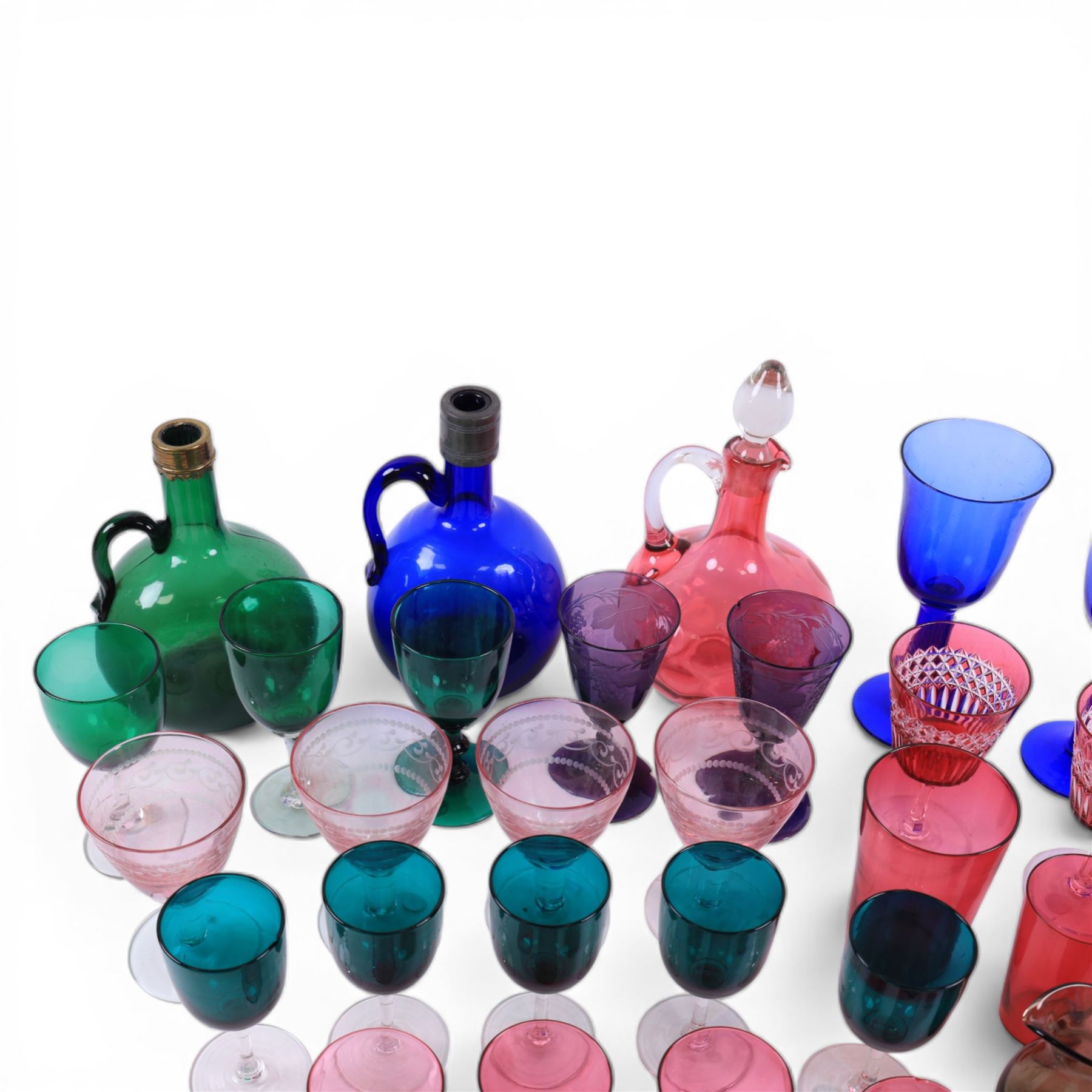 Group of Victorian and later coloured glassware, to include Victorian blue glass flagon, and similar green example, each with metal moulded rim, assorted cranberry, green, amethyst and blue glass drinking glasses, etc., in one box