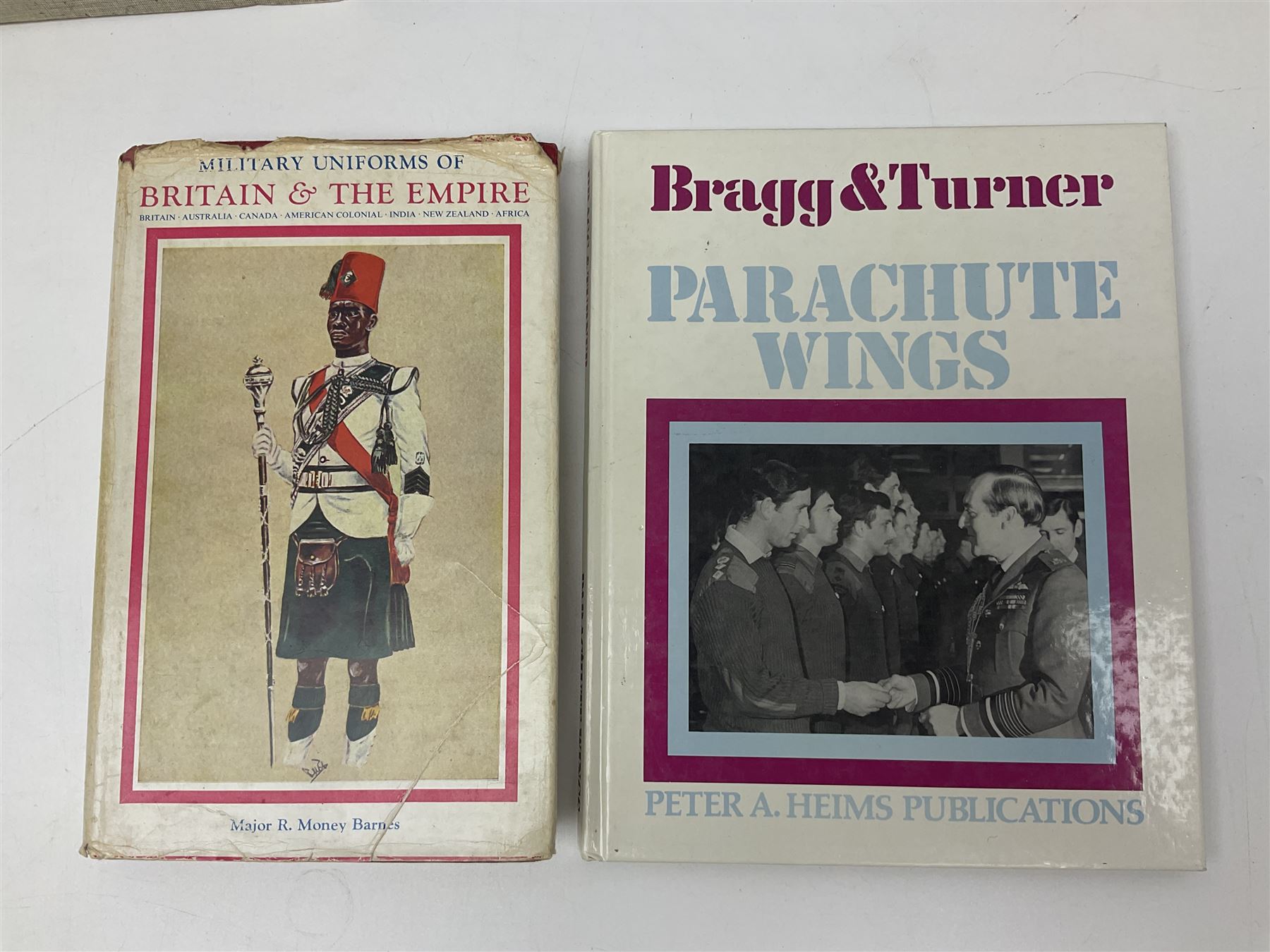 Seven military reference books - Histoire Mondiale Des Parachutistes; Yves Debay: French Foreign Legion  Paratroopers; Bragg & Turner: Parachute Wings; Barney White-Turner: Horse Guards; and three works on uniforms/standards (7)