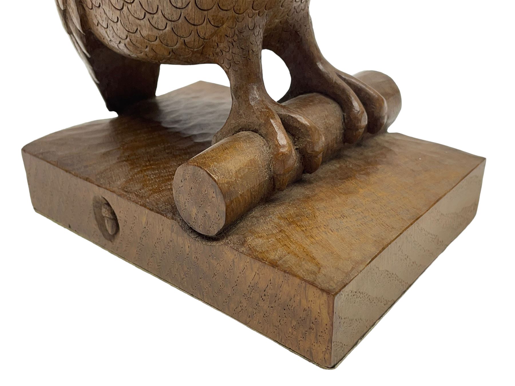 Acornman - carved oak owl perched on branch, on tooled block plinth carved with acorn signature, by the workshop of Alan Grainger, Brandsby (carved by Norman Darnley)