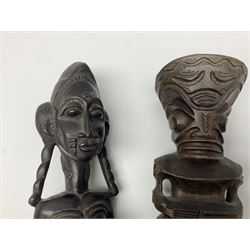 Carved african figures, together with a polynesian figure, largest H38cm