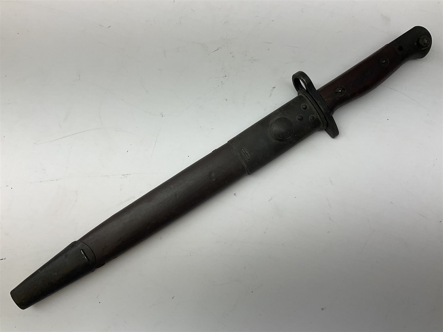 Australian Owen sub-machine gun bayonet, the 25.5cm fullered steel blade marked '53'; in metal bound wooden scabbard marled MA53 L41cm overall