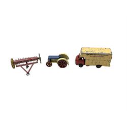 Dinky die-cast tractor; Dinky hay Rake; Dinky telephone box and another larger; Dinky petrol pump; two other petrol pumps; pillar box; road sign; street lamp; and Zebra Toys Cattle Transporter (11)