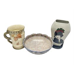 Charlotte Rhead for Crown Ducal ceramics, comprising coffin shaped vase depicting a woman in 1920s dress, a vase with handle, decorated with autumn leaves and a bowl, decorated with flowers and berries, with printed and signed marks beneath, coffin vase H24cm