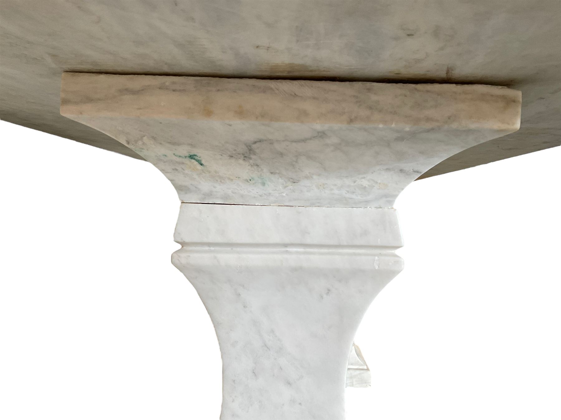 Classical Grecian design Carrera marble centre table, the rectangular single slab top with rounded corners and carved edge, raised on twin pedestals comprised of three pieces with a waisted column on a stepped plinth