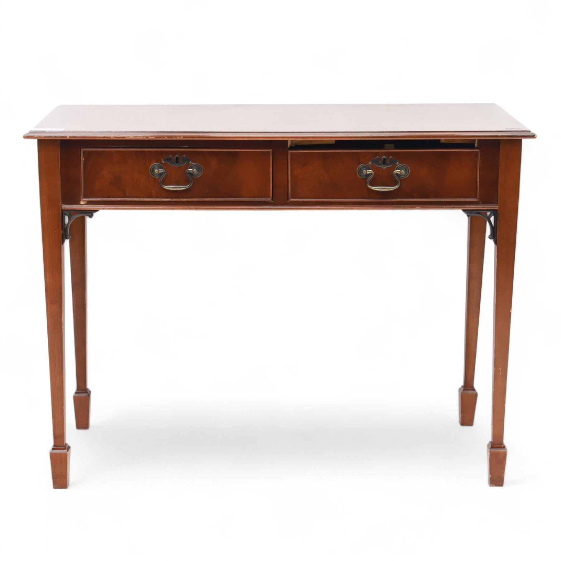 Edwardian design mahogany desk, crossbanded rectangular top above twin drawers with brass handles, raised on square tapering legs terminating in spade feet