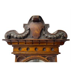 J Hicks - Hatton Garden London, - late 19th century carved oak cased Fitzroy barometer in a richly carved case with a carved crested pediment and square cistern cover, inverted opaline register reflecting FitzRoy's predictions and a scale from 27 to 31 inches of barometric pressure, with a thick bore cistern tube and adjustable rack and pinion twin vernier, fitted with a glazed snail bulb mercury thermometer recording the air temperature in both Fahrenheit and Celsius. Mercury clean and present.
James Joseph Hicks was born in Ireland, however, early in his life he moved to London where he was apprenticed to the instrument maker Louis P Casella. In 1860 he went into business in his own right as a scientific instrument maker at 8 Hatton Gardens. In 1864 he was granted membership to the British Meteorological Society and exhibited instruments at the Royal Society Exhibitions between 1876 and 1913. Hicks was one of London's most prolific and eminent barometer makers. 