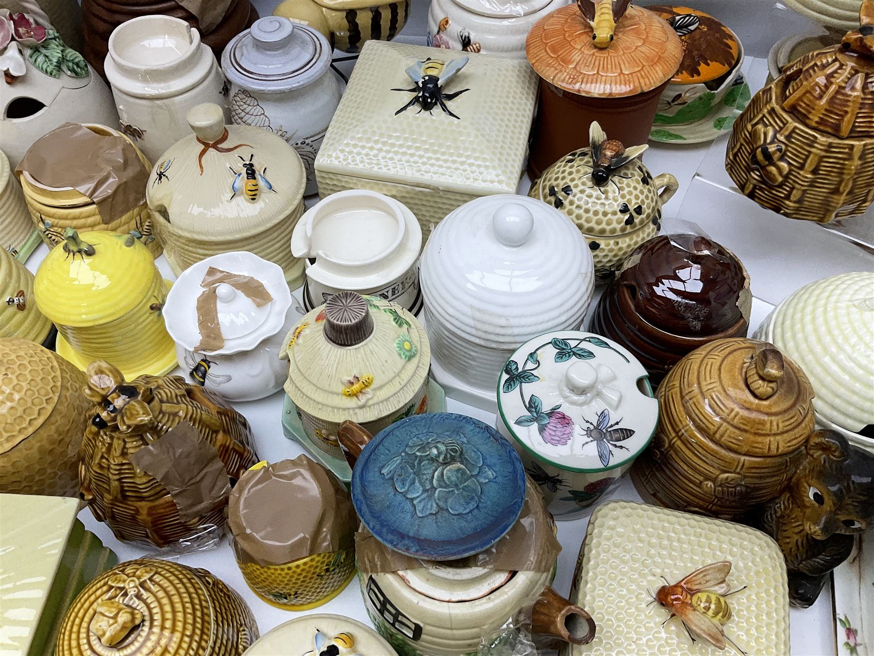 Large collection of honey pots, of various shapes, to include examples from Crown Devon, Marutomo ware, W.H Gloss, Goebel etc 