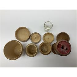Collection of Mauchline ware, including sewing accessories, comprising ovoid spool holder and thimble case, needle case and a ribbon dispenser, together with a scent bottle holder, hairpin case and four glass holders