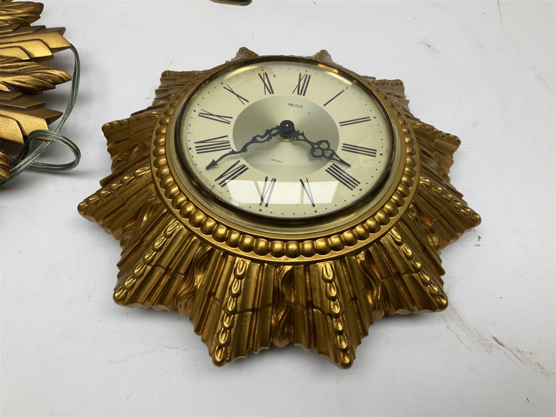 Two Smiths Sectric gilt sunburst wall clocks together Metamec Dereham wooden mantel clock, largest wall clock D35cm