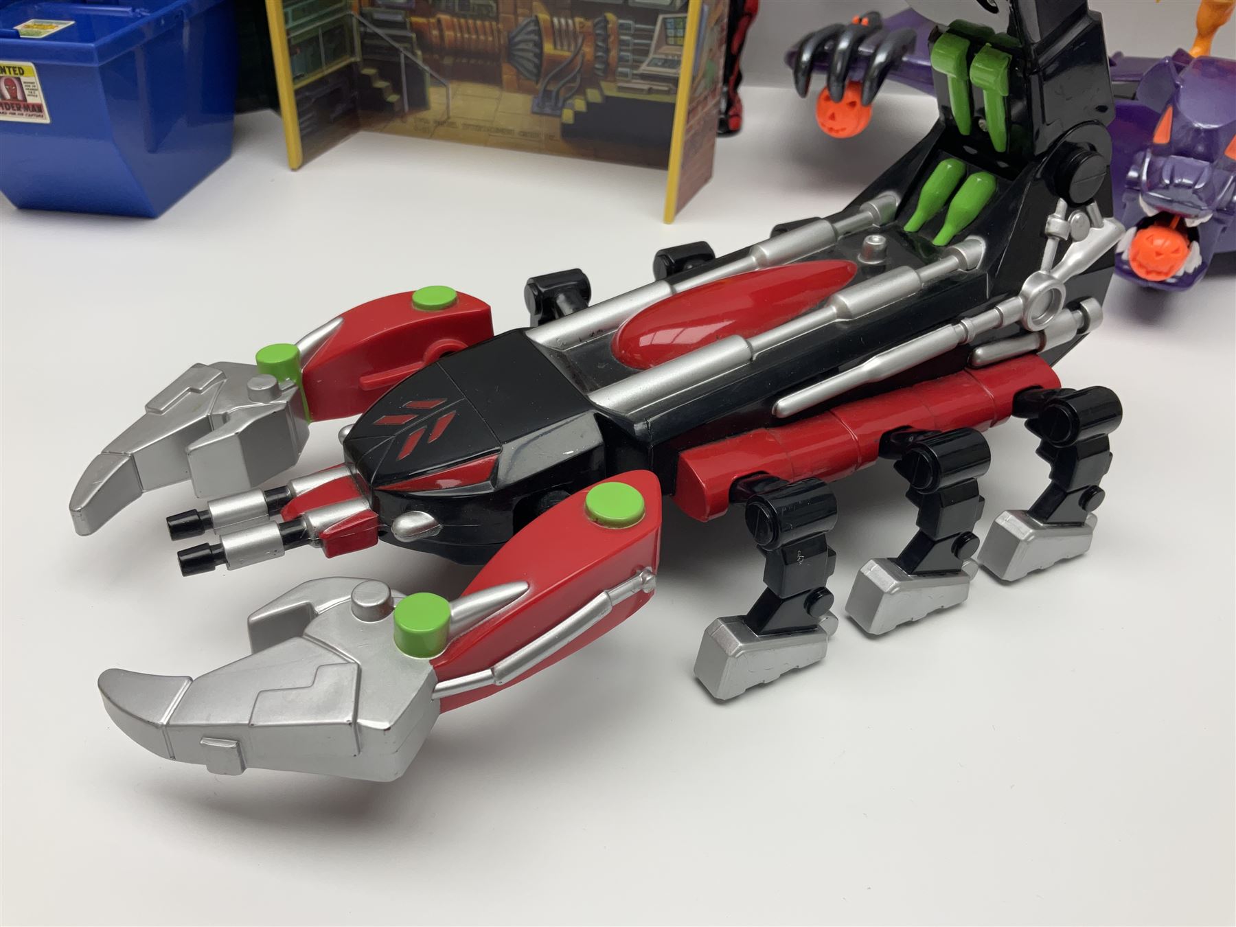 Group of early 90s Marvel/DC Comics toys; 1993 Kenner Batmobile with original Batman figure and plane; Marvel Comics Spider-Man 1994 Web of Steel series Hobgoblin Wing Bomber, incomplete Daily Bugle Playset and Scorpion; assorted figurines and later accessories 