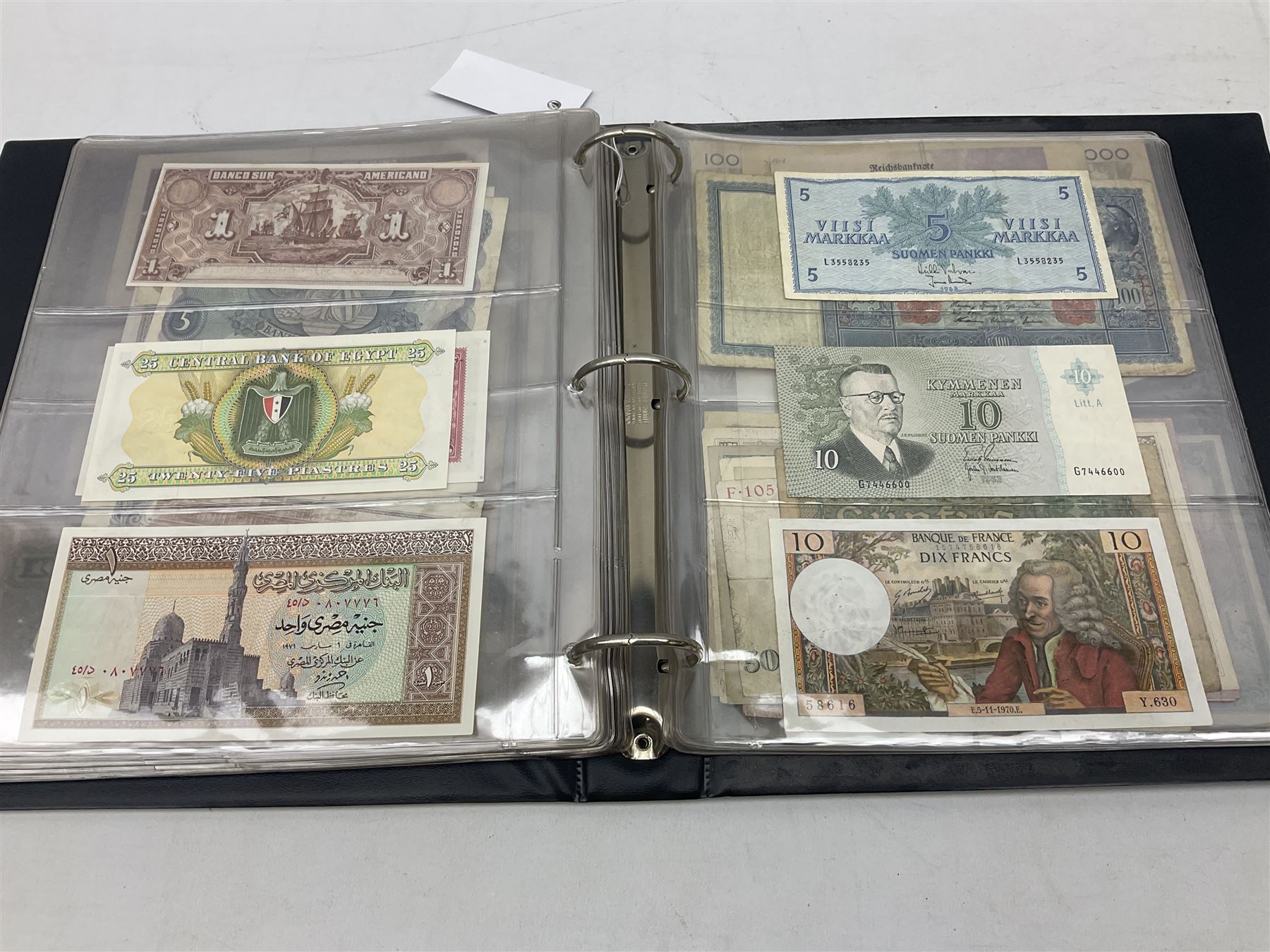 World banknotes, including Queen Elizabeth II The States of Jersey one pound 'DB202703', five pounds 'BB527762' and ten pounds 'AB651481', reserve bank of New Zealand two dollars '1L3 741894', King George V Straits Settlements one dollar 1st January 1935 'F/83 28924', various Bank of England notes etc, housed in two ring binder albums