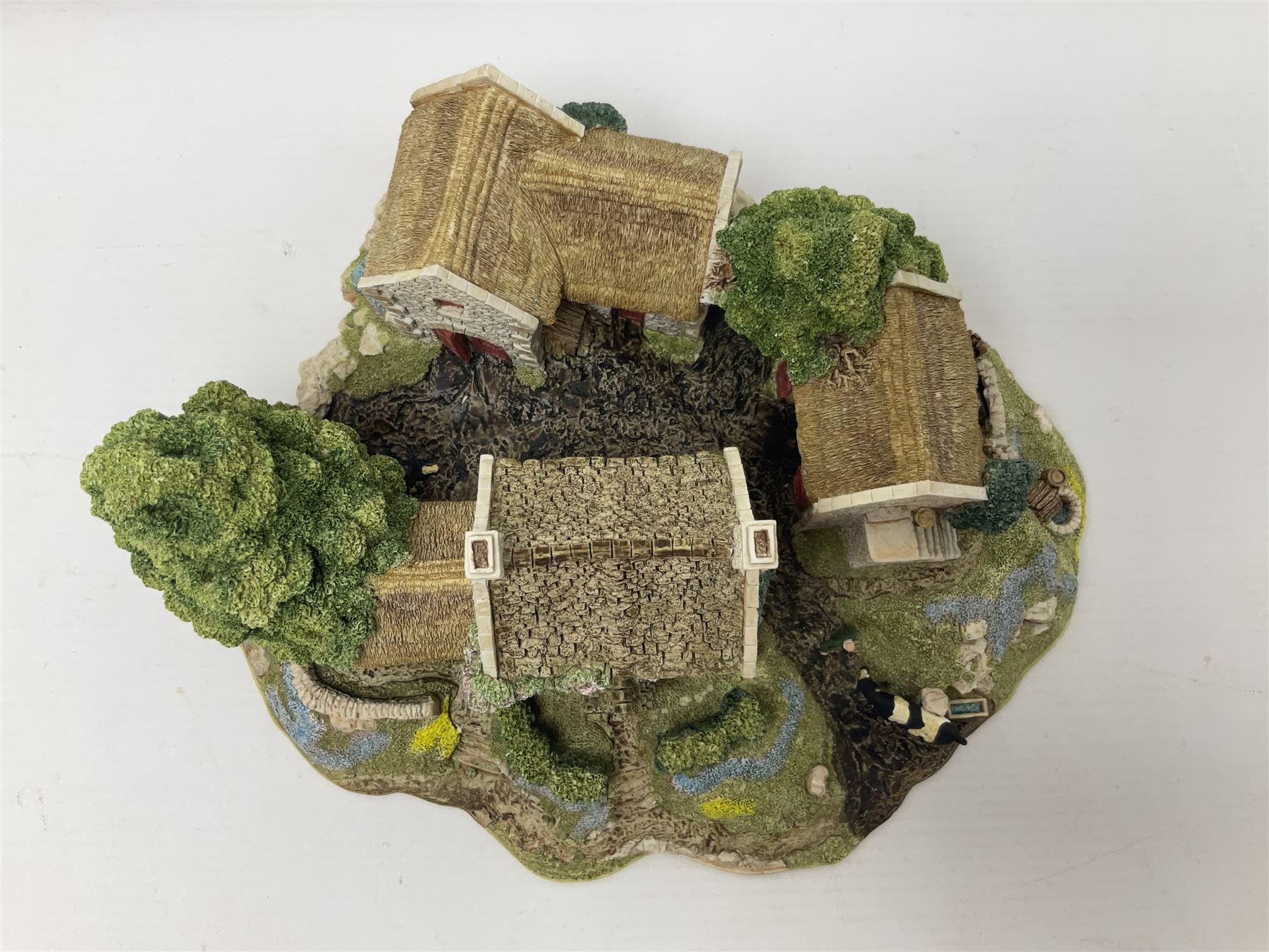 Three Lilliput lanes, comprising Oakwood Smithy, Anne of Cleves and Bluebell Farm, all with deeds and original boxes 