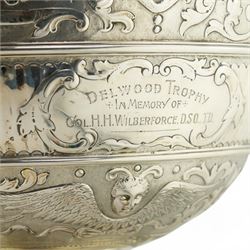 'Delwood Trophy in Memory of Col. H.H. Wilberforce' - A large Victorian silver rose bowl embossed with masks, wings, scrolls etc on a short pedestal foot D29cm London 1882 Maker Walter & John Barnard 