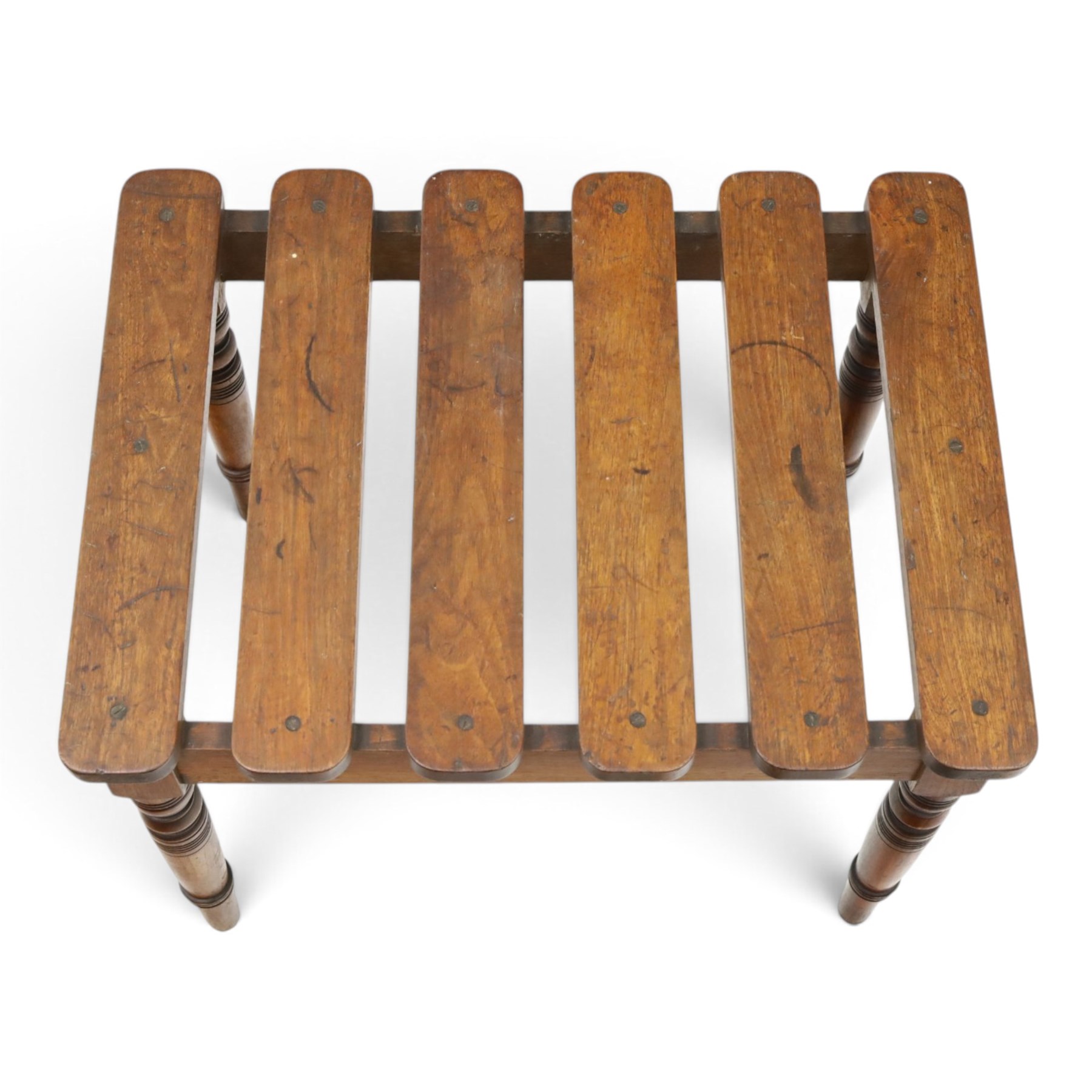 Victorian mahogany luggage stand, slatted top of rectangular form over plain frieze rails raised on ring turned supports