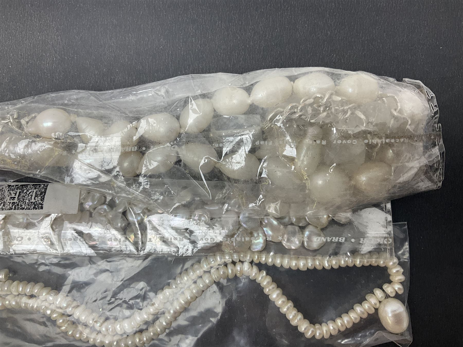 Fresh water pearl jewellery, including chain bracelet and seven necklaces, including pink example and some with silver clasps