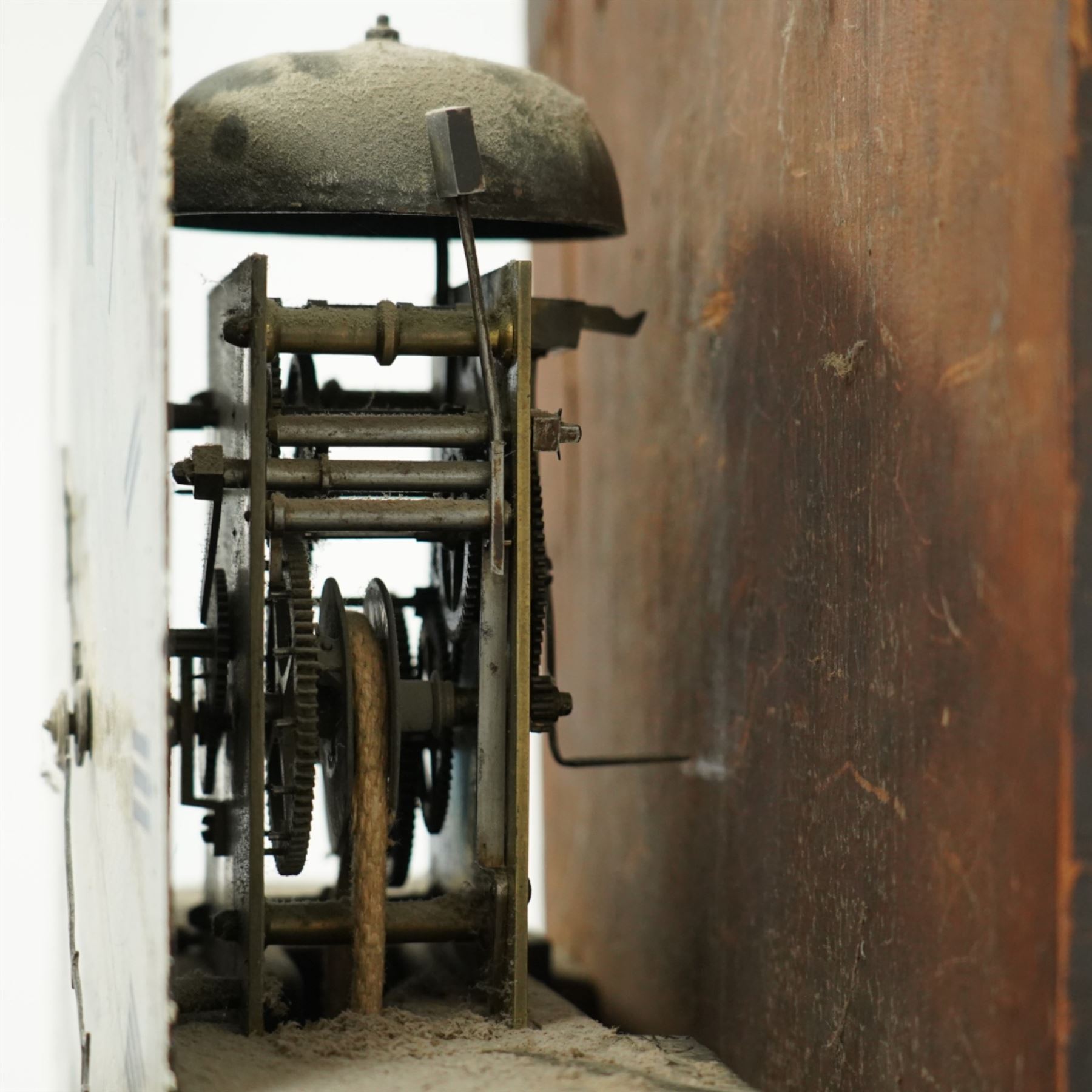 John Bull of Bedford-early 19th century provincial oak cased 30-hour longcase clock c 1830, with a swan necked pediment and brass patera, square hood door with detached reeded pilasters with brass capitals,
trunk with a long door with a shaped top on a square plinth with a shaped base, painted dial with floral spandrels, makers name, steel hands, Roman numerals and minute track, dial pined to a rope driven countwheel striking movement, striking the hours on a bell. With pendulum.
John Bull (1802-1870) was the founding father of a prodigious family of Bedfordshire clockmakers working in Bedford from the early 19th century until the mid 20th century. 