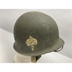 American first type paratrooper helmet with post-WW2 strap and D-rings and later 1944 liner bearing Firestone Tyre and Rubber Company mark; green textured finish