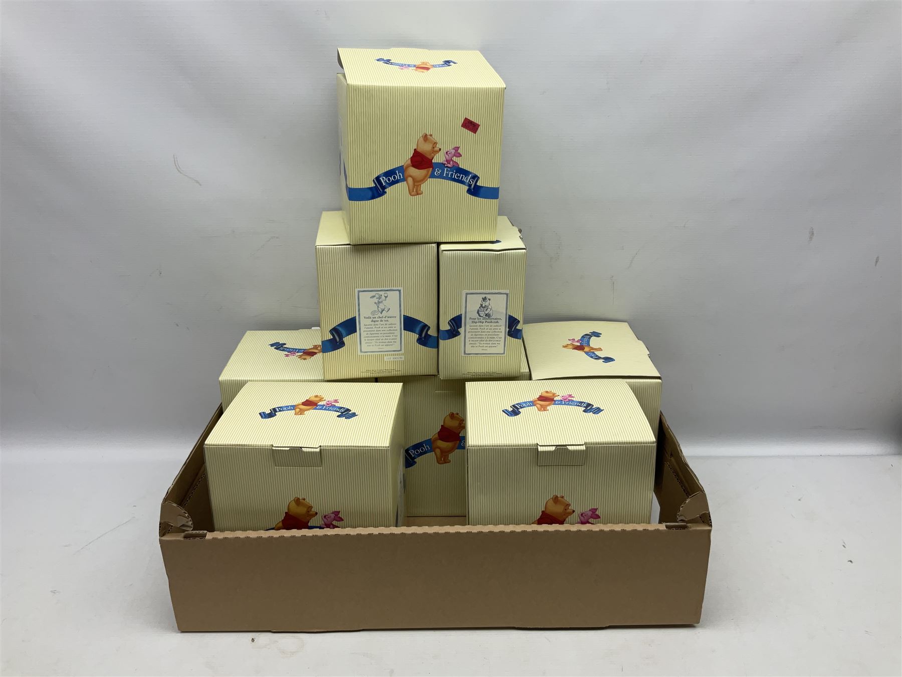 Collection of eight Disney Pooh and Friends figures, comprising Hip, hip Poohray for birthdays, Tricks and treats for someone sweet, We'll share forever whatever the weather, Thanks for being a Caring Sort of Bear, Now it's perfect just like you, Have a red-shirt red letter day, Life is sweet and I love you Mama, all with boxes