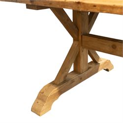 Pine country x-framed dining table, a rustic plank top raised on two x-framed supports